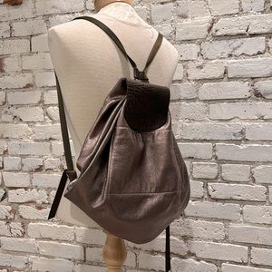 Soft, metallic bronze leather backpack made by hand.